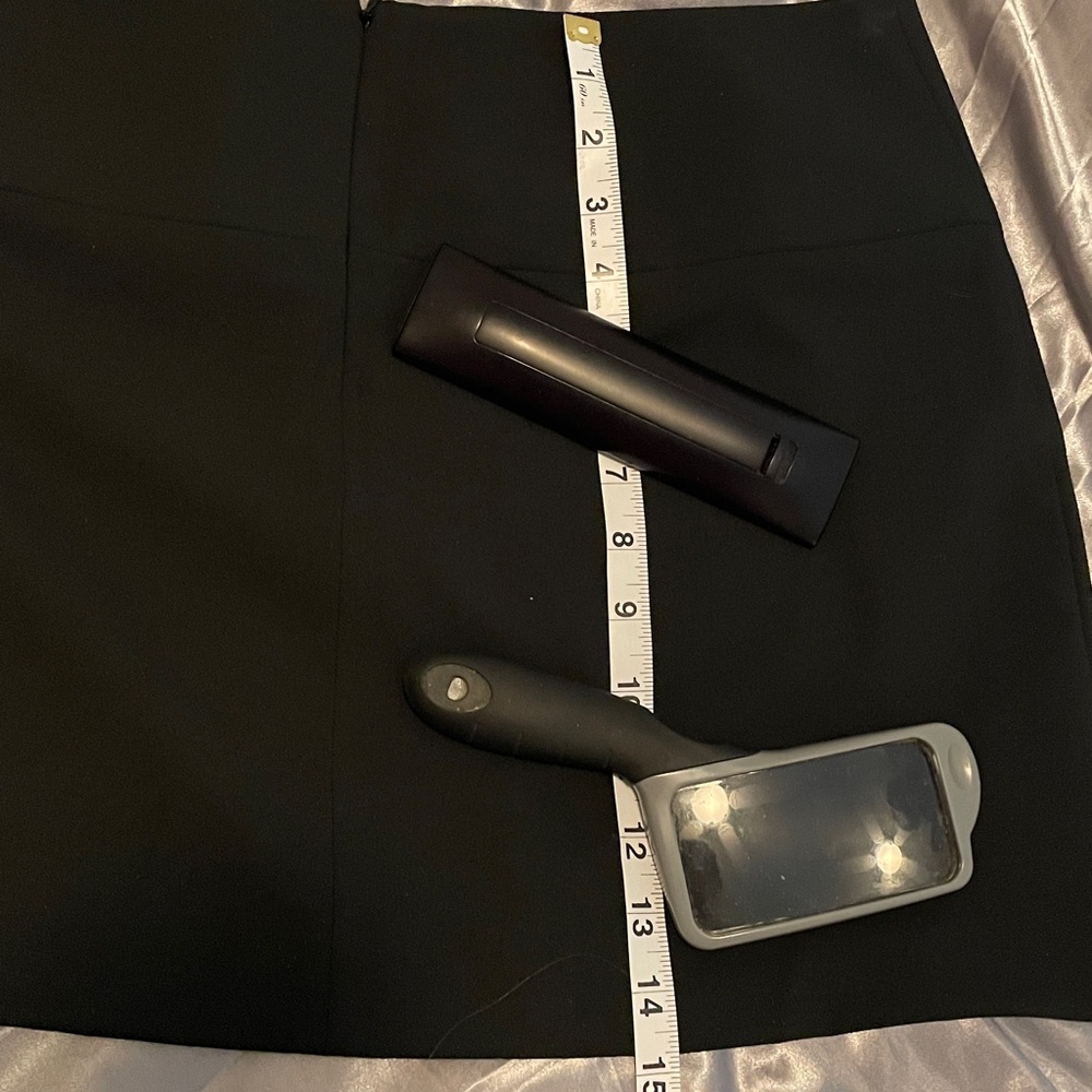 Express Design Studio ladies size 8 black mini skirt.